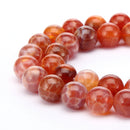 burnt orange fire agate smooth round beads