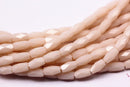 peach pink crystal glass faceted rice tube beads