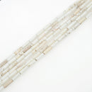 white turquoise round tube beads
