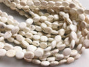 white turquoise flat oval beads