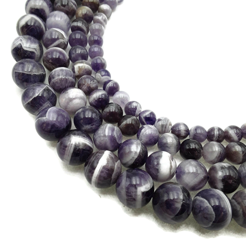 Buy wholesale Amethyst beads between 4 and 12mm AC - 12mm