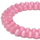 pink cats eye smooth round beads
