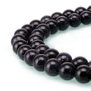 blue sandstone smooth round beads