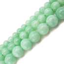 cloudy emerald green dyed jade smooth round beads