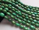 dark green turquoise smooth oval shape beads