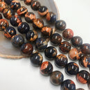 sunset sodalite smooth round beads 