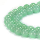 light green dyed jade smooth round beads