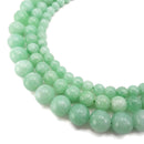 cloudy emerald green dyed jade smooth round beads