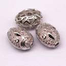 silver plated oval shape charm