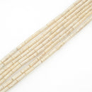 river stone round tube beads