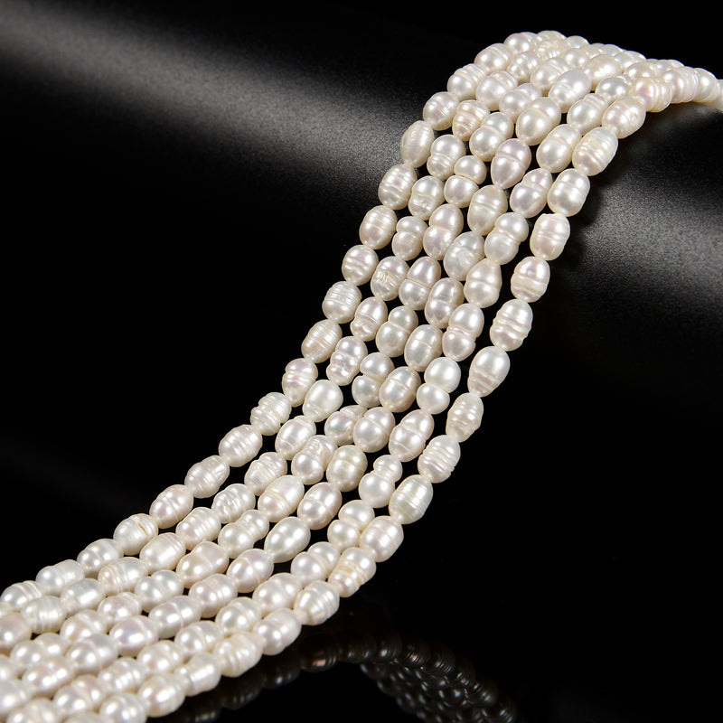 White Fresh Water Pearl Rice Shape Beads Size 4x6mm 14'' Strand