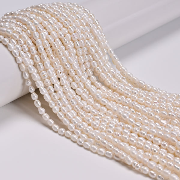 White Fresh Water Pearl Ringed Rice Shape Beads Size 3mm x 4-5mm 14'' Strand