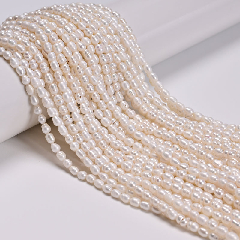 White Fresh Water Pearl Ringed Rice Shape Beads Size 3mm x 4-5mm 14'' Strand