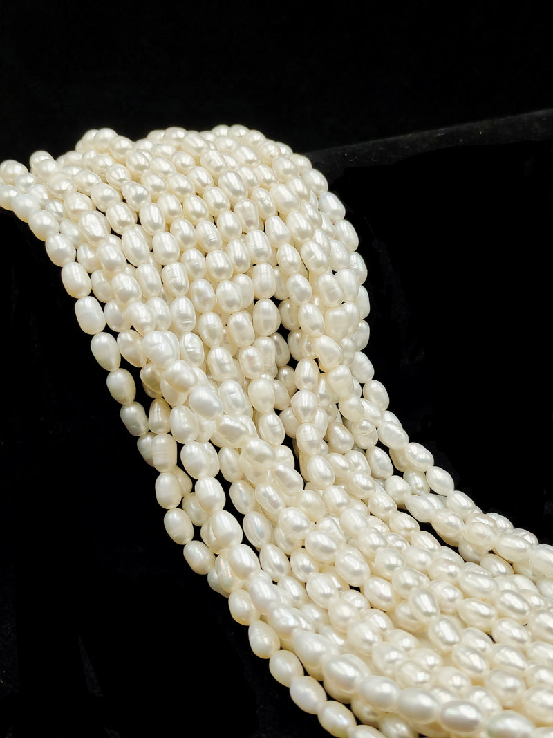 White Fresh Water Pearl Rice Shape Beads Size 4x6mm 14'' Strand