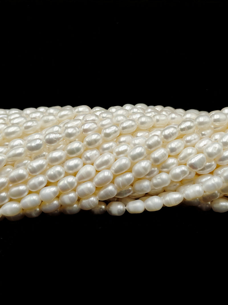 White Fresh Water Pearl Rice Shape Beads Size 4x6mm 14'' Strand