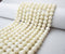 white bamboo coral smooth round beads