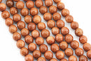 gold sandstone faceted round beads