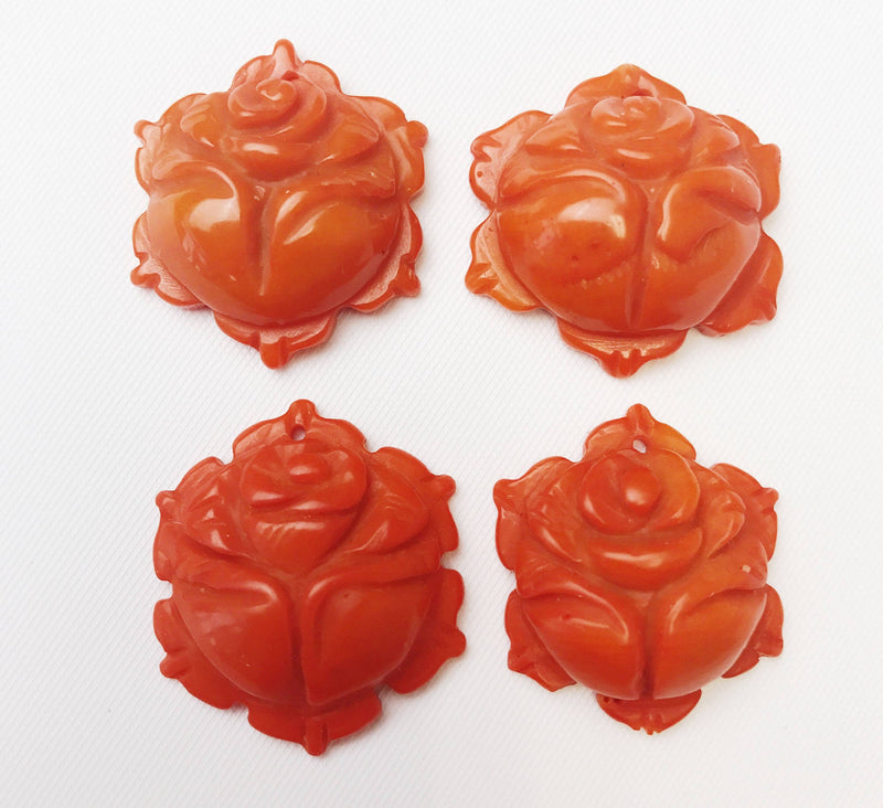 orange bamboo coral hand carved flower pendant