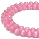 pink cats eye smooth round beads 