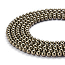 gold pyrite smooth round beads 