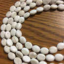 white turquoise flat oval beads 