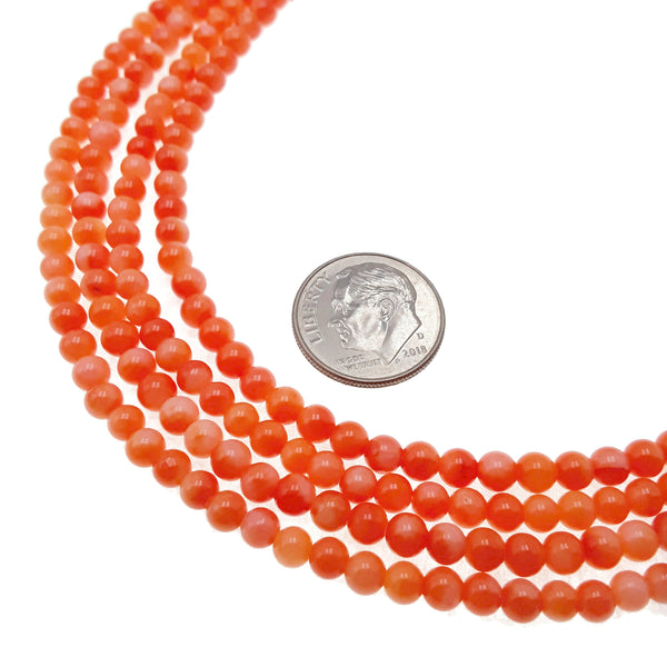 orange bamboo coral smooth round beads