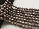 brown snowflake obsidian faceted round beads